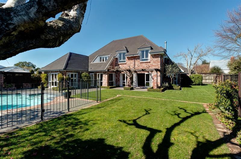 Professional lawn mowing service in Christchurch backyard